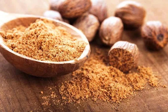 Whole nutmeg and spice associated with traditional culinary and evening rituals